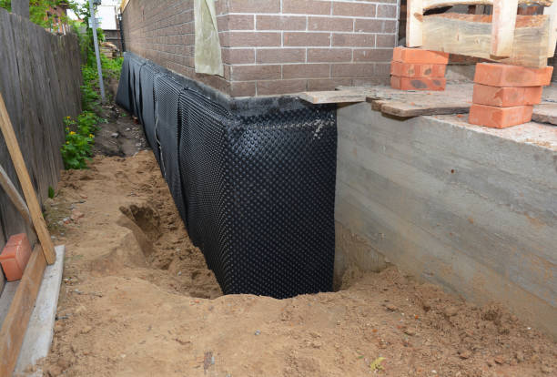 Happy homeowners after waterproofing job in Elkridge